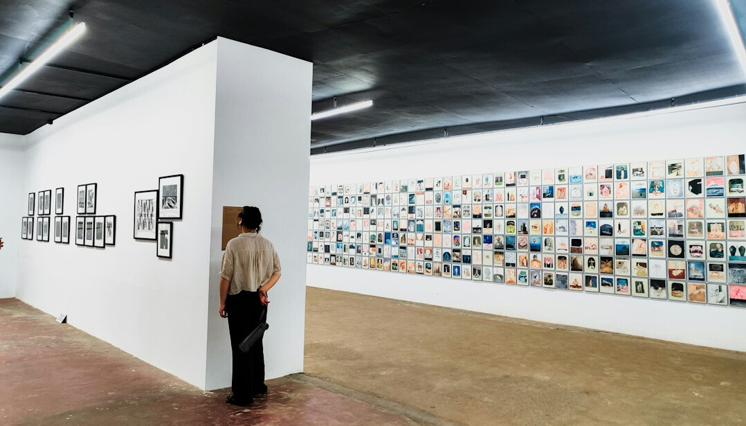 Wall of broadcast monitors in a gallery