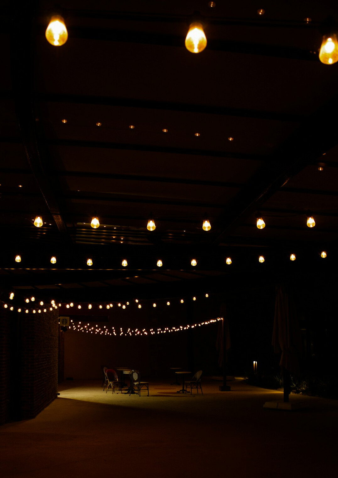 Speaker stage with warm lighting in an empty conference hall