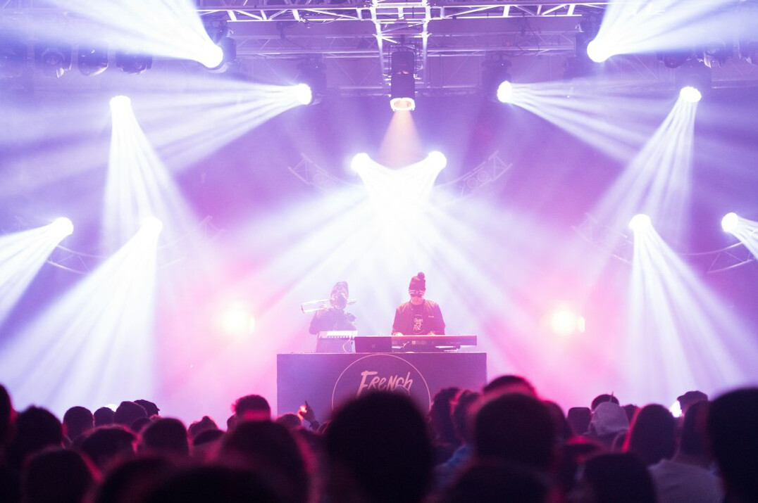 Live event stage with audience and bright lights