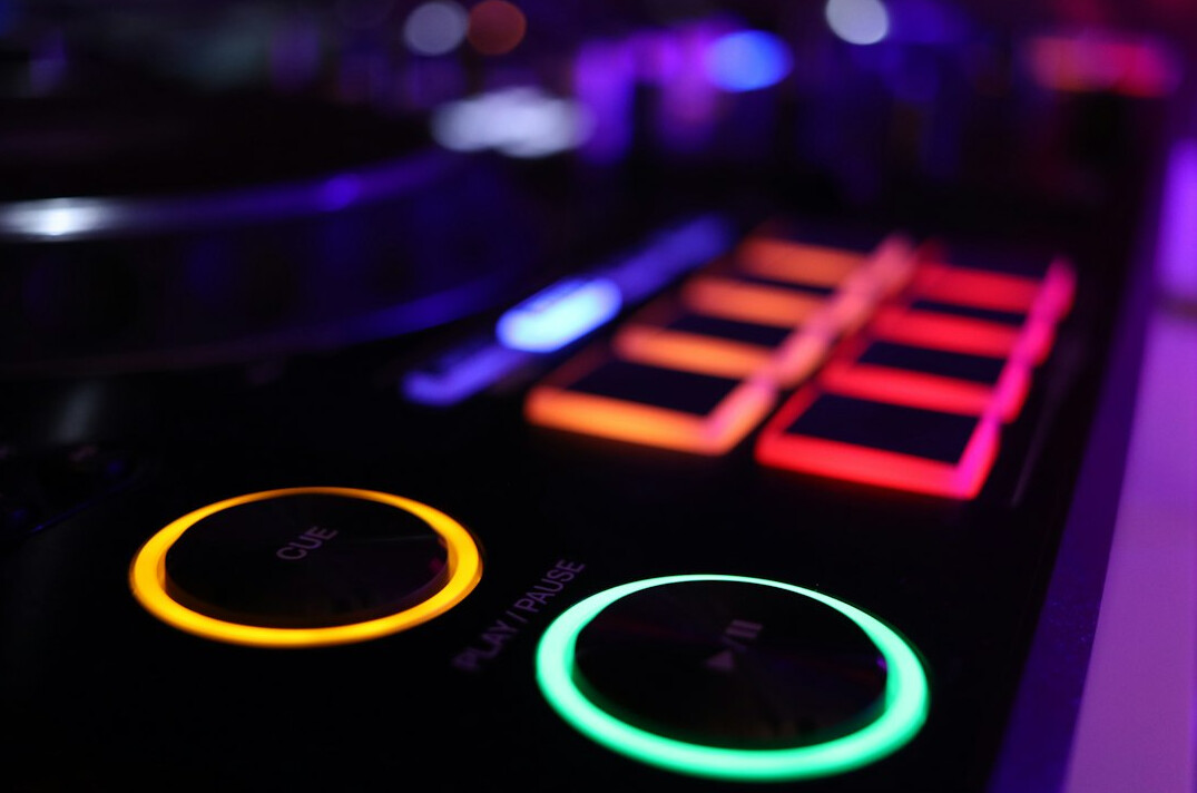 Control desk with glowing sliders and coloured lights